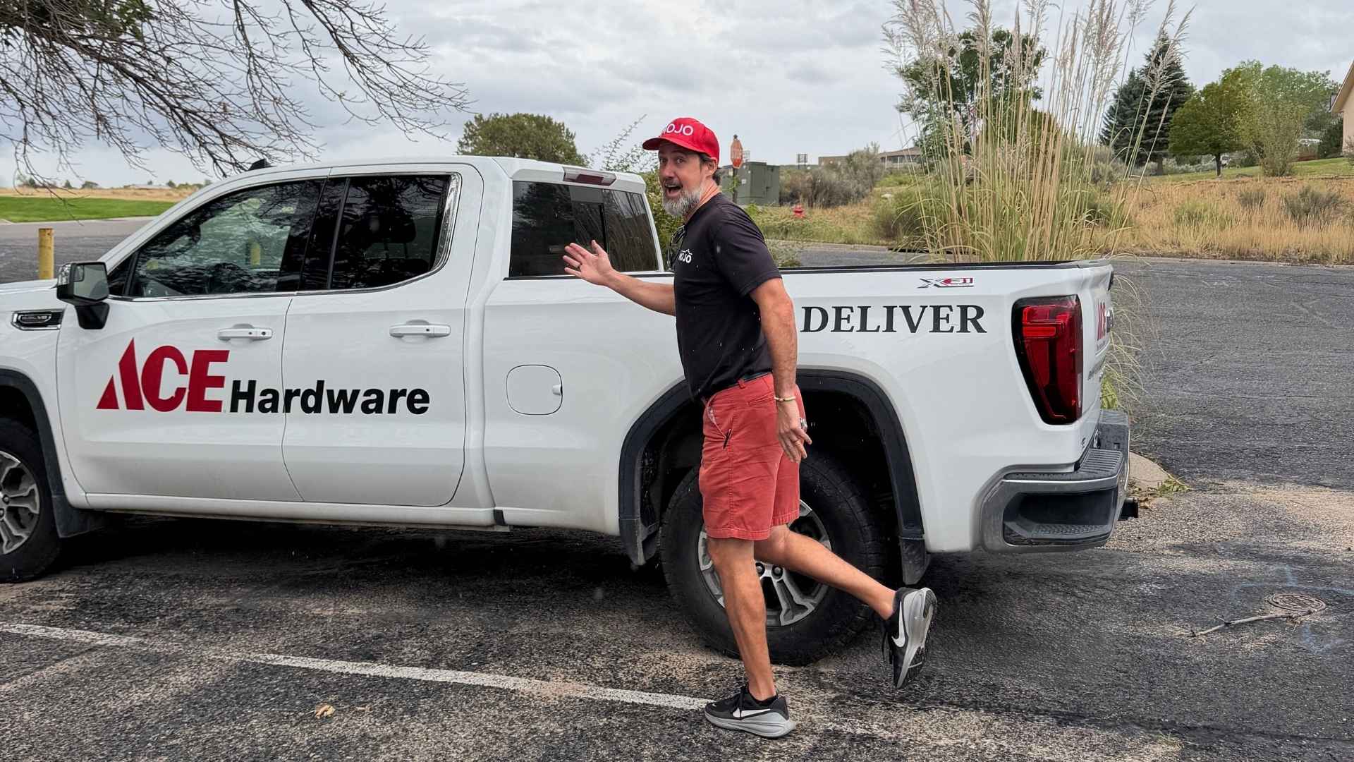 Rand in front of a free delivery ace truck